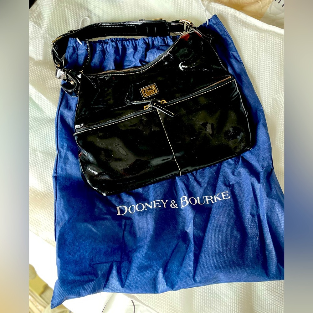 Gently used, no major damage Dooney and Burke set